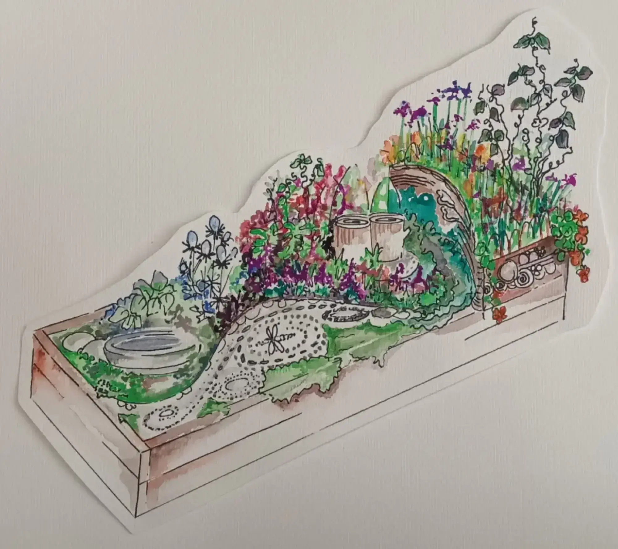 A vibrant raised garden border featuring a winding patterned lizard path, a bird bath, and colourful mixed planting with insect habitats and climbing plants.