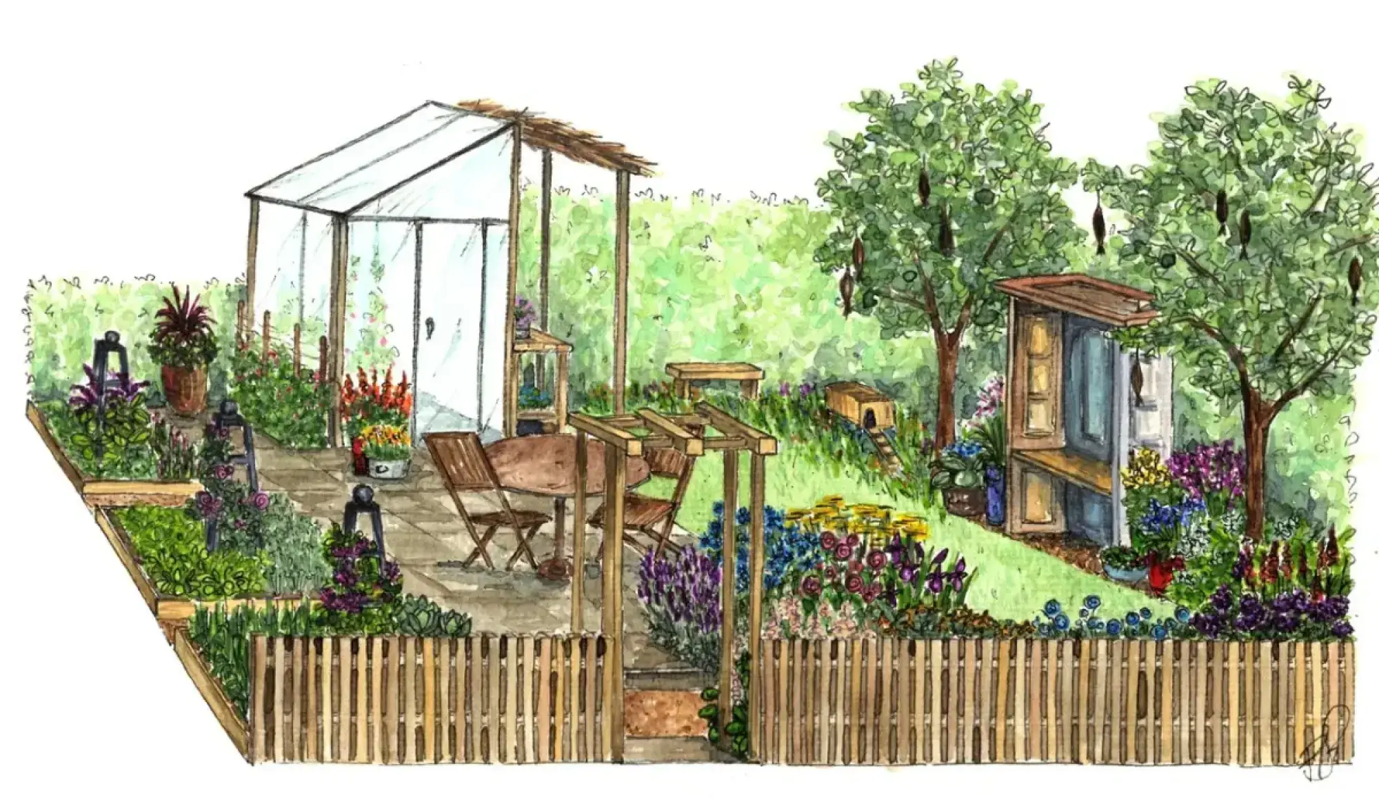 A cheerful show garden with a glass greenhouse, wooden shed, patio dining, colorful flowers and trees, all framed by a picket fence.