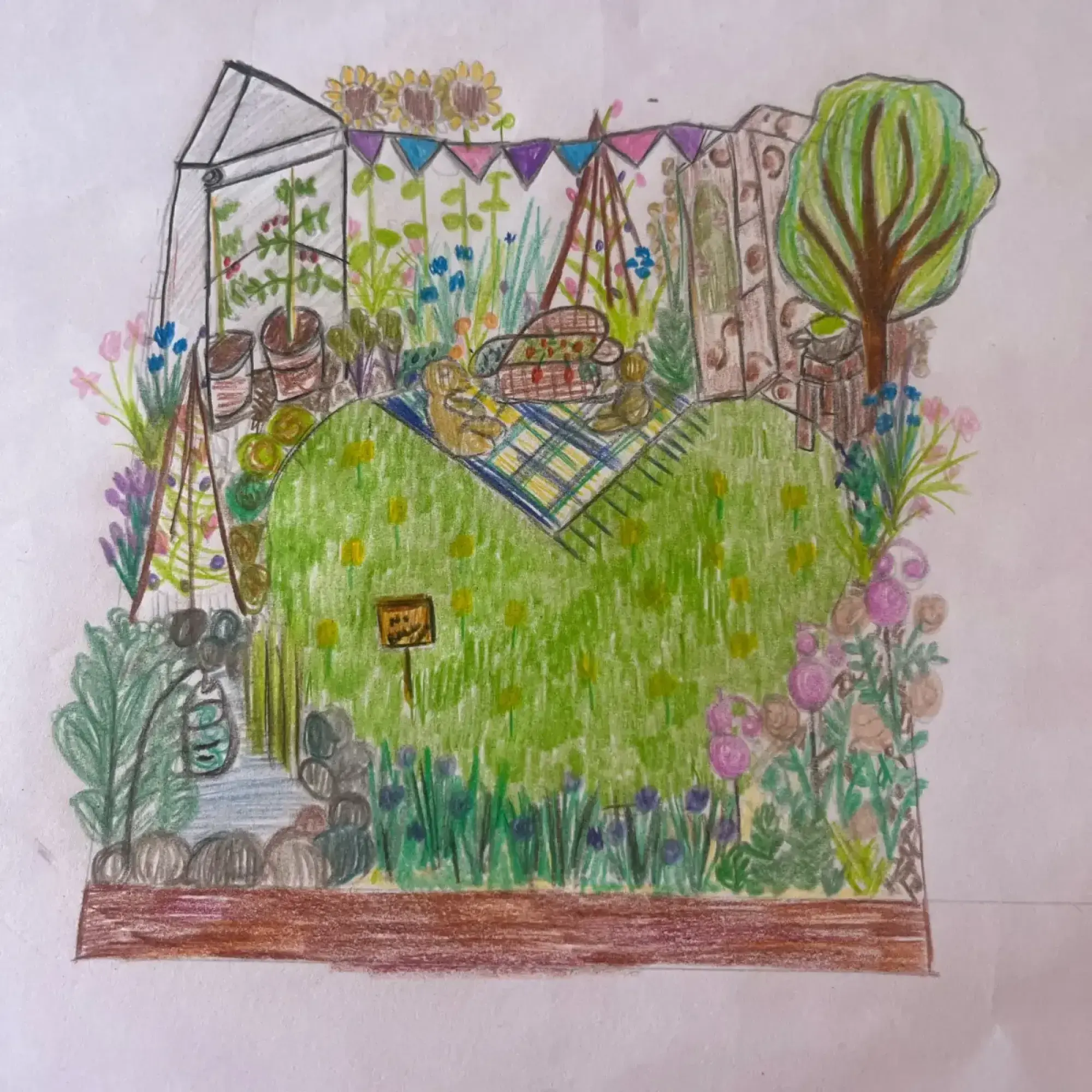 A colourful, whimsical 'Beautiful Borders' garden featuring a greenhouse, a picnic scene with blanket and basket, a small tree, and vibrant mixed floral planting with sunflowers and blooming flowers.